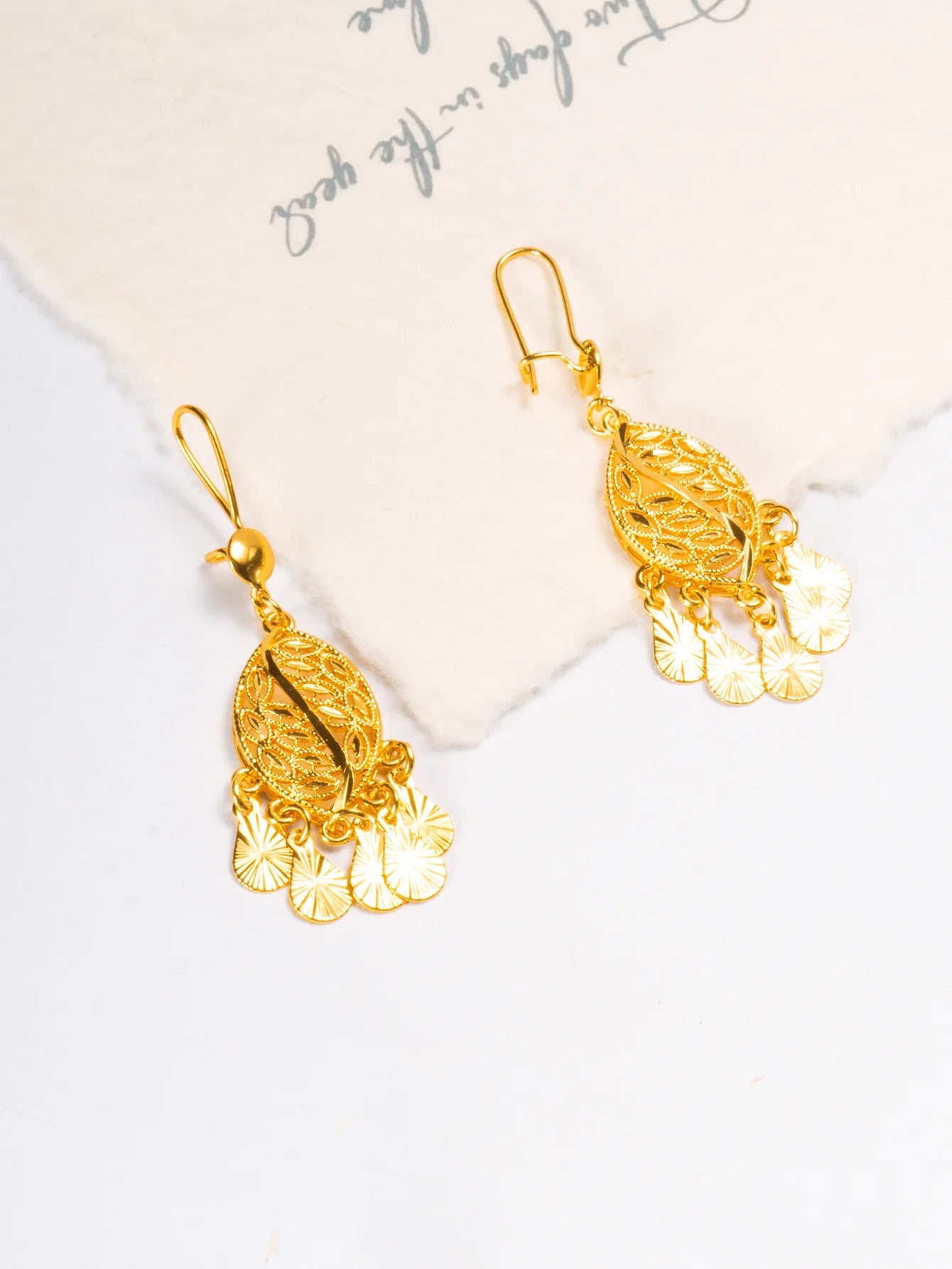 24K Pure Gold AU999 Leaf Tassel Earrings, swaying gracefully to showcase feminine charm and exude elegance